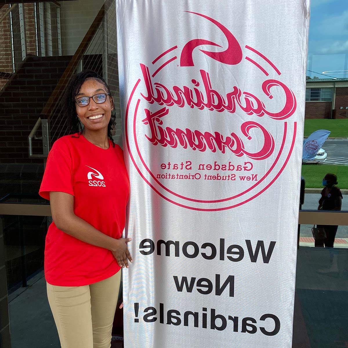 A Gadsden State ambassador welcomes students to Cardinal Commit 